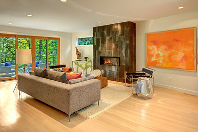 Large trendy open concept light wood floor living room photo in Seattle with beige walls, a standard fireplace and a stone fireplace