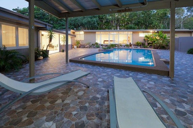 Design ideas for a modern pool in Brisbane with tile.