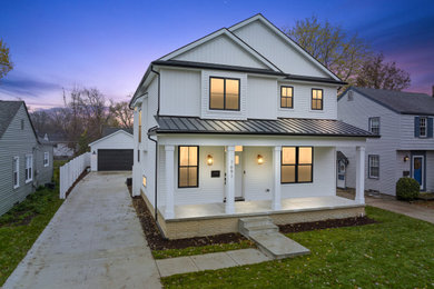 Example of a country exterior home design in Detroit