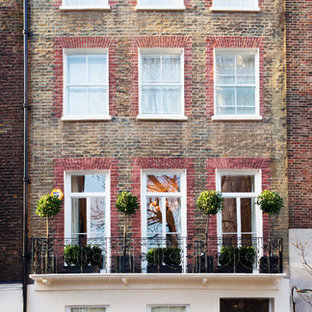 Idéer för stora vintage bruna radhus, med tre eller fler plan, tegel, sadeltak och tak med takplattor