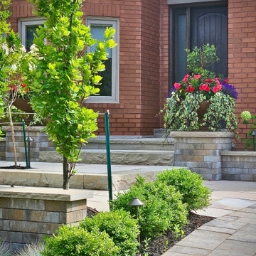 Layered Front Entrance Planting with Stone Retaining Walls
