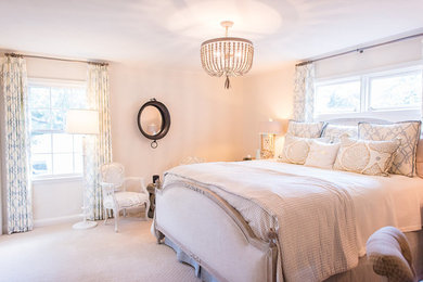 Mid-sized elegant master medium tone wood floor and brown floor bedroom photo in Austin with beige walls and no fireplace