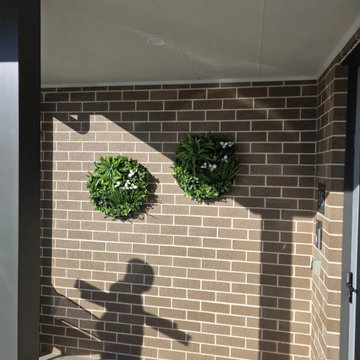 An Outdoor Space Enriched by Artificial Green Walls and Discs