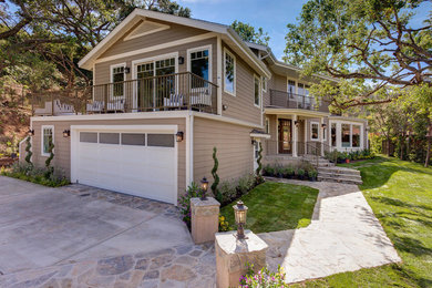 Inspiration for a large timeless green two-story wood exterior home remodel in Los Angeles