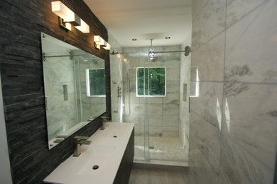 Mid-sized minimalist master black and white tile bathroom photo in DC Metro with dark wood cabinets and solid surface countertops