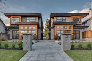Small trendy two-story mixed siding exterior home photo in Vancouver