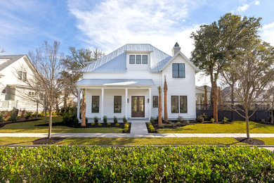 Large farmhouse white two-story concrete fiberboard gable roof idea in Charleston