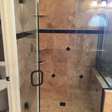 Custom Travertine Bathroom with Black Galaxy Accents