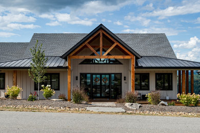 Mid-sized transitional white one-story concrete fiberboard and board and batten exterior home idea in Other with a mixed material roof and a black roof