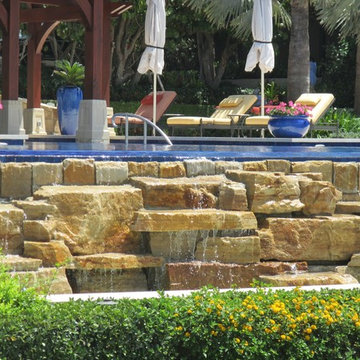 Pool rock waterfall infinity edge