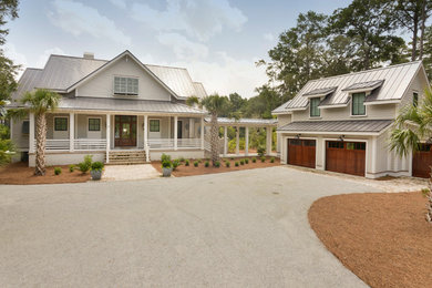 Design ideas for a mid-sized traditional two-storey exterior in Charleston.