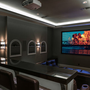 Transitional enclosed carpeted home theater photo in Dallas with gray walls and a projector screen