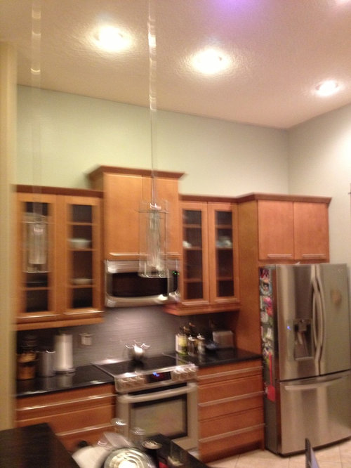 What To Put Above Kitchen Cabinets In A Tall I Am Still Left With About 3 1 2 Feet Of Empty Space Above The Cabinets Any Suggestions Willing To Change Wall Color From Its Cur Cremè De