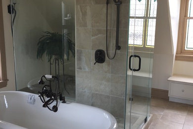 Example of a large beach style master beige tile and ceramic tile ceramic tile and beige floor bathroom design in Philadelphia with beige walls and a hinged shower door