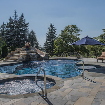 Pool with Waterfall, Slide, and Spa
