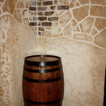 The Walls Feature a Stone and Brick Appearance in this Wine Cellar Design TX