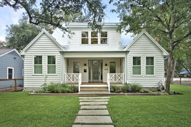 Inspiration for a transitional white wood gable roof remodel in Austin