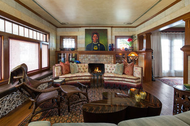 Mid-sized arts and crafts formal and enclosed medium tone wood floor and brown floor living room photo in Seattle with a standard fireplace, a tile fireplace, beige walls and no tv