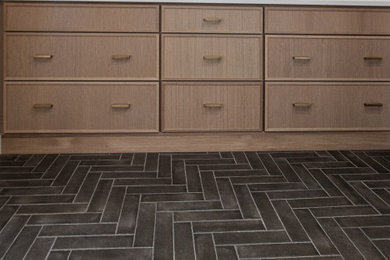 Example of a transitional master ceramic tile porcelain tile, black floor and double-sink bathroom design in Other with flat-panel cabinets, light wood cabinets, quartz countertops, white countertops and a built-in vanity