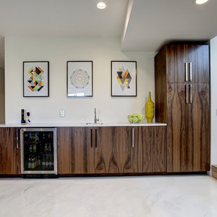 Medium sized contemporary basement in Grand Rapids with white walls, marble flooring, no fireplace and white floors.