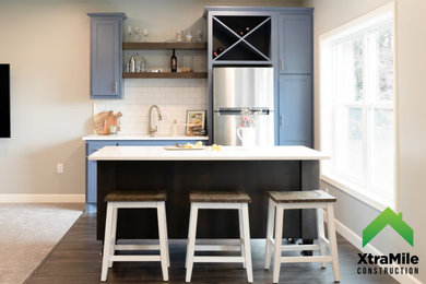 Example of a transitional home bar design in Minneapolis
