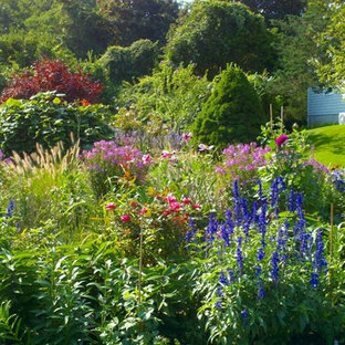 Design ideas for a large traditional front yard garden in Boston with a container garden and mulch.