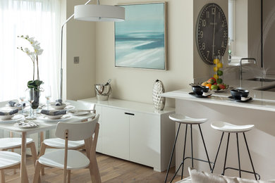 This is an example of a beach style dining room in Dorset.