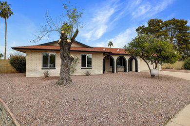 Example of a cottage exterior home design in Phoenix
