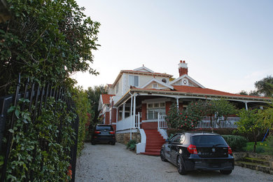 Photo of a large traditional home design in Perth.