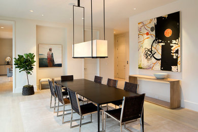 Enclosed dining room - large contemporary light wood floor enclosed dining room idea in San Francisco with white walls and no fireplace