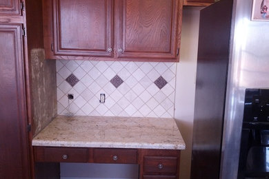 Inspiration for a kitchen remodel in San Diego with black backsplash and ceramic backsplash