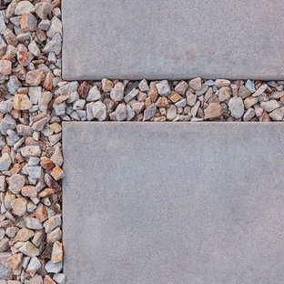 Inspiration for a mid-sized modern front yard full sun garden in Phoenix with with path.