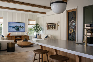 Inspiration for a transitional exposed beam and wall paneling family room remodel in Orange County