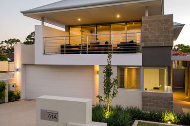 Example of a trendy home design design in Perth