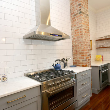 Open shelving and exposed brick are among the many details that encompass the si