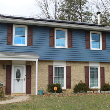 Blue Siding & White Trim and Gutter System