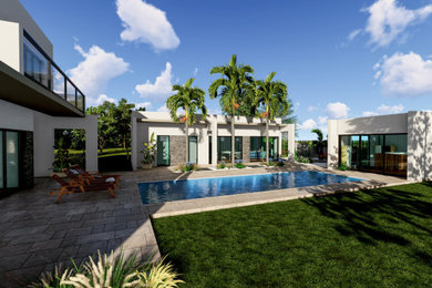 Inspiration pour un grand piscine avec aménagement paysager design avec des pavés en pierre naturelle.