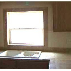 Full view of travertine Kitchen countertop and window - Kitchen Countertops