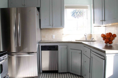 Inspiration for a contemporary kitchen remodel in San Diego with an undermount sink, open cabinets, gray cabinets, concrete countertops, beige backsplash, ceramic backsplash and stainless steel appliances