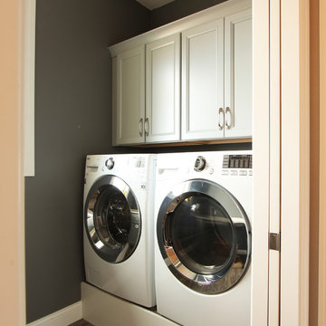 Built up Washer and Dryer with Deep Cabinets Above