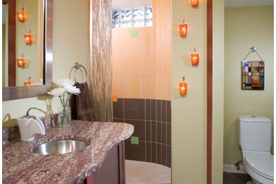 Inspiration for a contemporary multicolored tile doorless shower remodel in Minneapolis with flat-panel cabinets