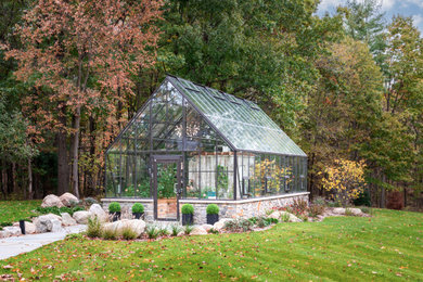 Example of an eclectic sunroom design in Detroit
