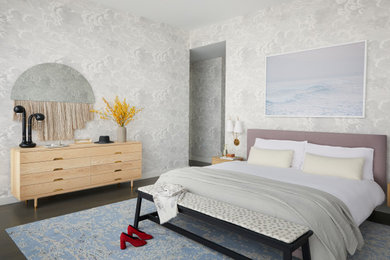 Example of a large trendy master medium tone wood floor, wallpaper and brown floor bedroom design in New York with gray walls and no fireplace