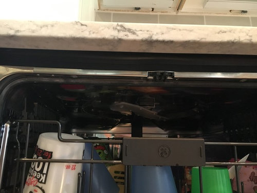 Help- already have cabinet damage in dishwasher surround!