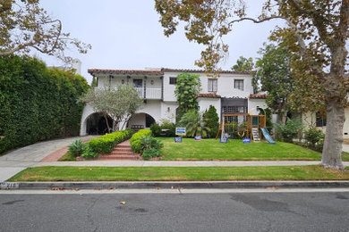 Mid-sized tuscan exterior home photo in Los Angeles