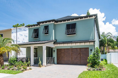 Photo of a large contemporary two-storey blue exterior in Tampa.