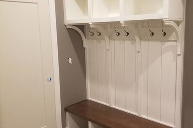 Mid-sized transitional multicolored floor and ceramic tile entryway photo in Cedar Rapids with gray walls and a white front door
