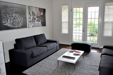 Example of a trendy living room design in Miami with white walls