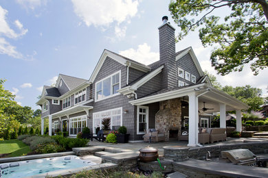 Inspiration for a large coastal gray split-level concrete fiberboard exterior home remodel in New York