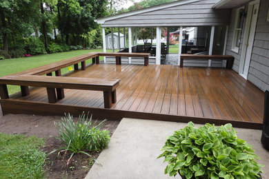 Photo of a mid-sized traditional backyard deck in New York with no cover.